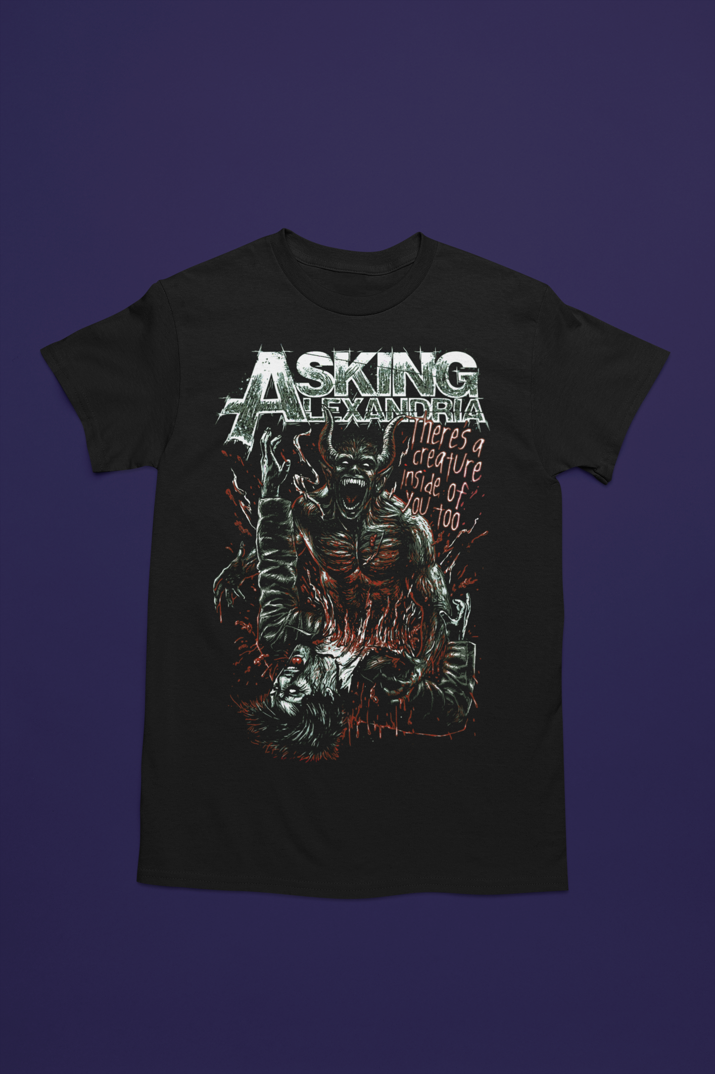 Camiseta negra de Asking Alexandra con diseño de demonio comiendose a una persona. Estampado en tonos rojos, y grises con el logo de la banda en la parte superior. Perfecta para fans del metalcore y del mitico grup Asking Alexandra