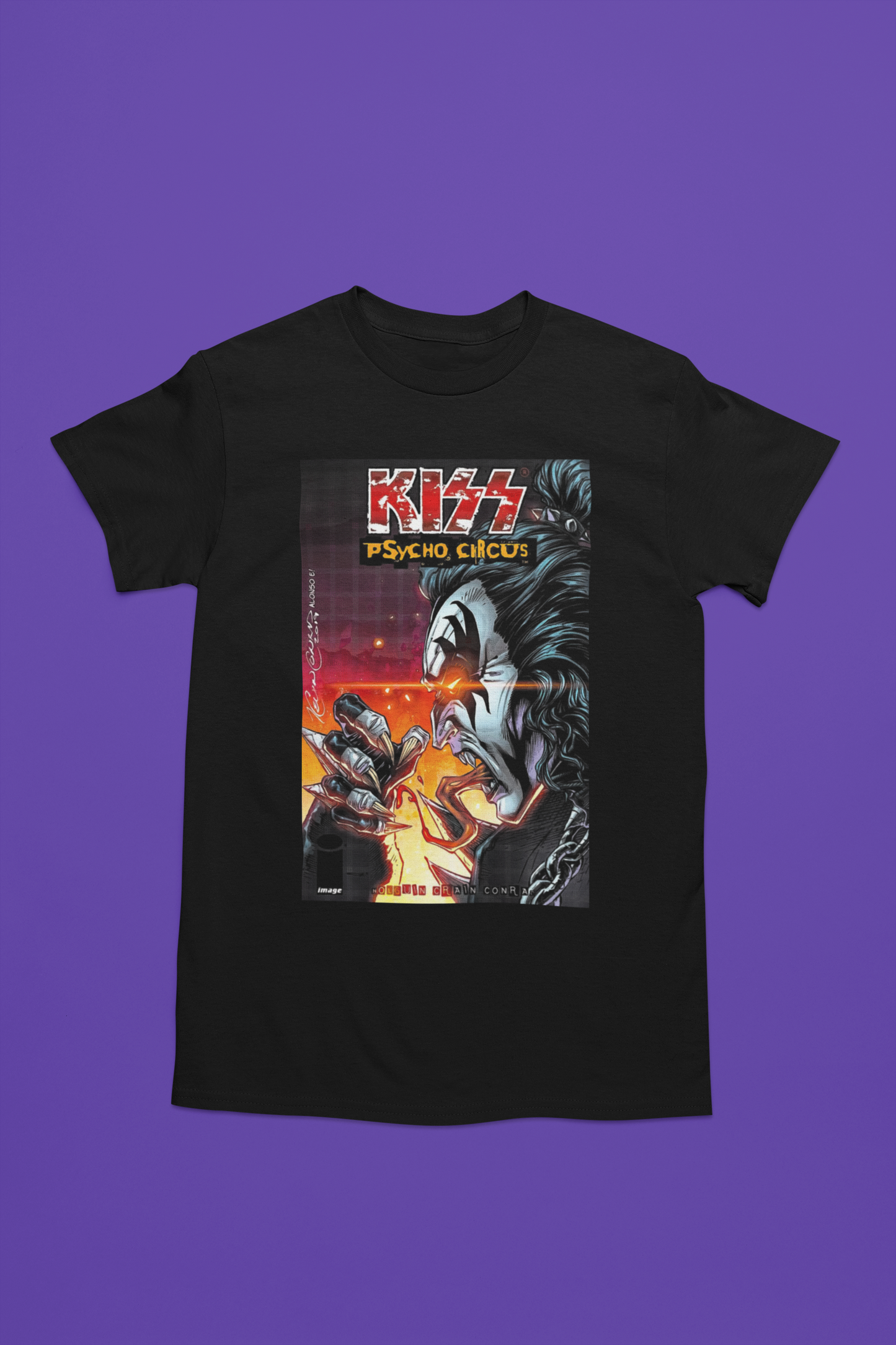 Camiseta negra con diseño de KISS "Psycho Circus", ilustración tipo cómic con personaje demoníaco y colores intensos en naranja y rojo.