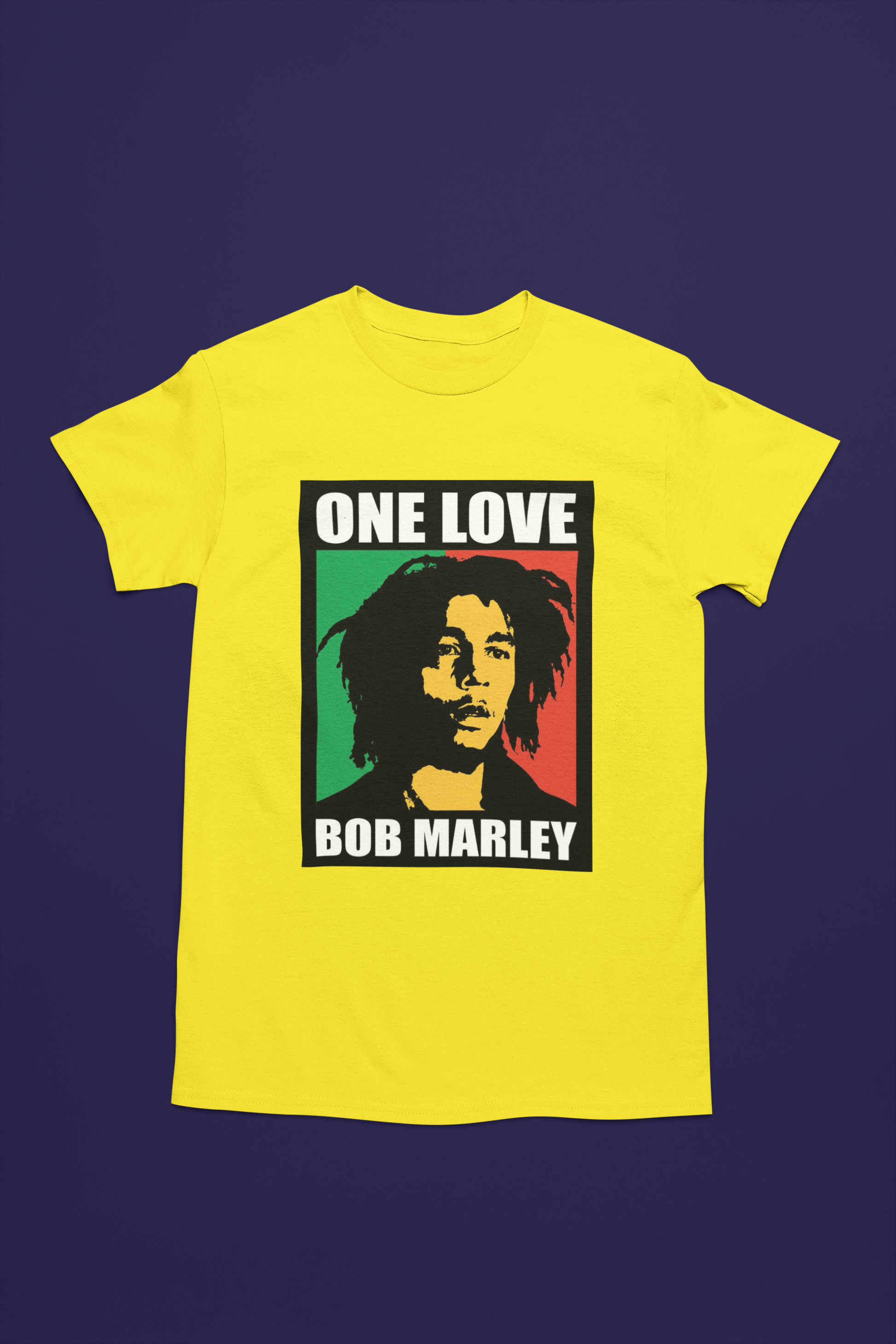 Camiseta amarilla con diseño de Bob Marley, texto “One Love” y fondo en colores verde, rojo y negro al estilo rastafari.